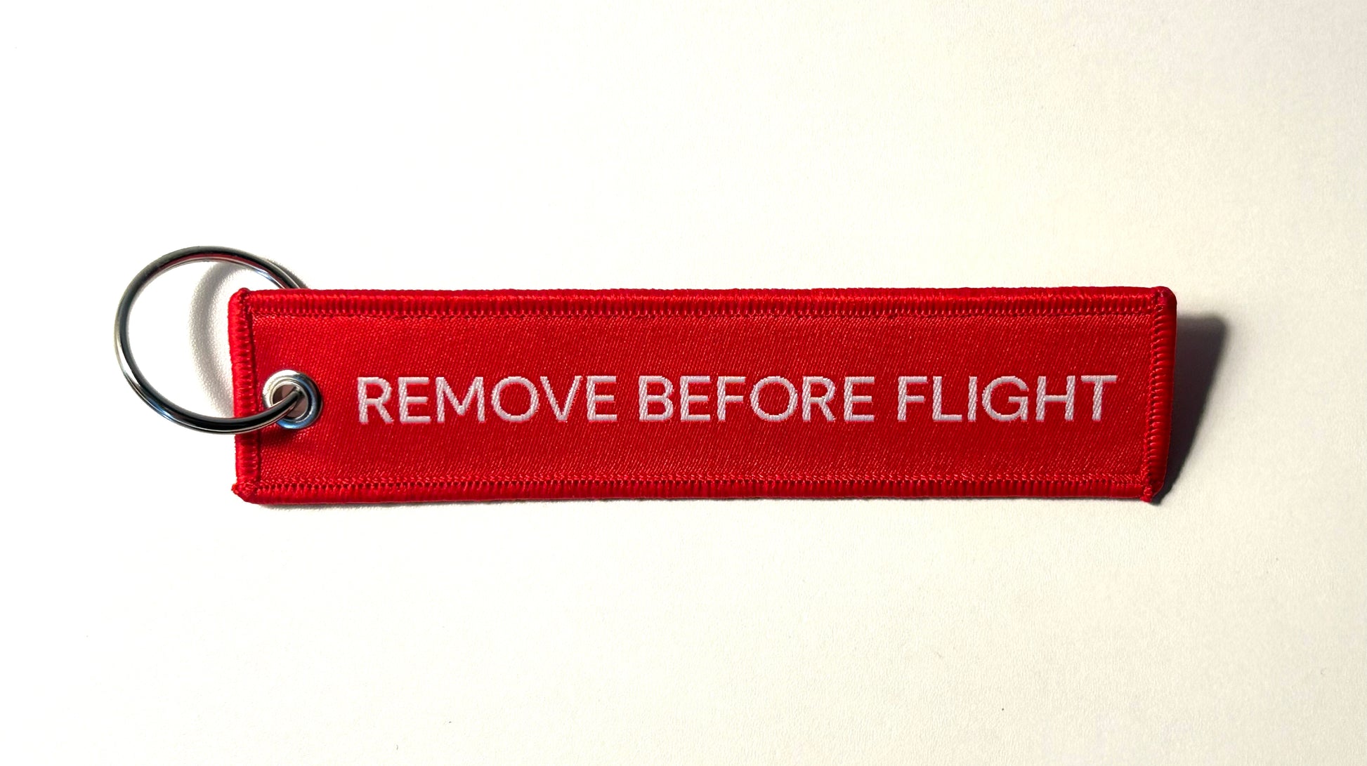 Brussels Airlines “Remove Before Flight” Key Ring, Red